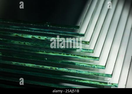 Glass factories produce glass used in buildings and homes. There are many different thicknesses and sizes. Stock Photo