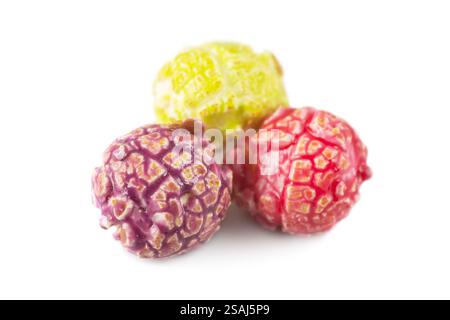 Colored fruity popcorn isolated on white background. Stock Photo