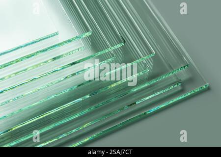Glass factories produce glass used in buildings and homes. There are many different thicknesses and sizes. Stock Photo