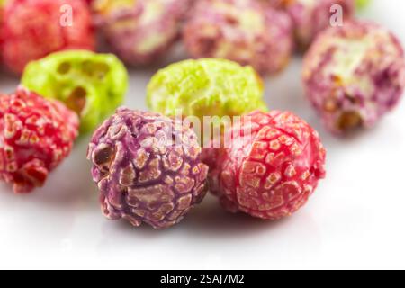 Colorful popcorn on white background close up. Stock Photo