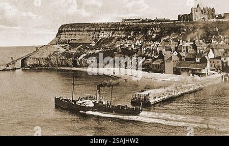 Steamship (paddle steamer) SCARBOROUGH leaving Whitby harbour (North Yorkshire)sailing tourists to Scarborough. In the background is the East side of the town with the parish church, abbey, Tate hill pier, Haggerlythe, Henrietta street, The Spa Ladder and Tate Hill Beach (Where Dracula's ship came aground in the famous novel by Bram Stoker. Stock Photo