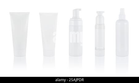 White cosmetic tubes and bottles isolate on white, serum, cream, micellar water. With dispenser. Set or collection. Stock Photo