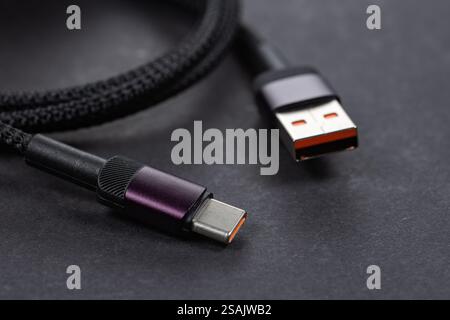 USB type A, USB type C cable on dark background. Stock Photo