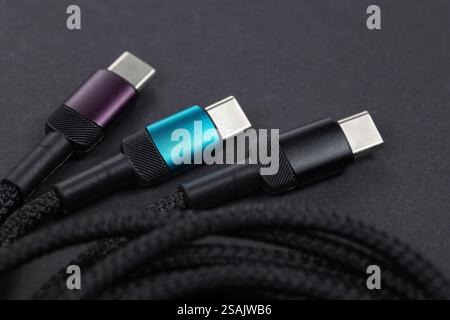 USB Type-C cable. Mobile data cable. Phone usb connector on dark background. usb cord charger, usb cable. Stock Photo