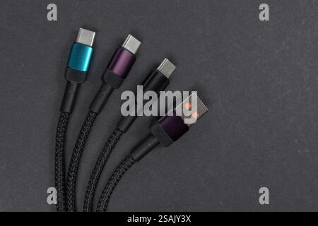 USB type A, USB type C cable isolated on dark background. Stock Photo
