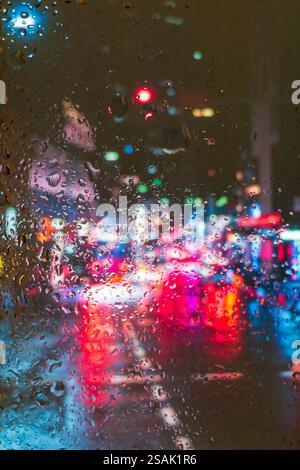 Autumn, rainy city through a window with raindrops Stock Photo - Alamy