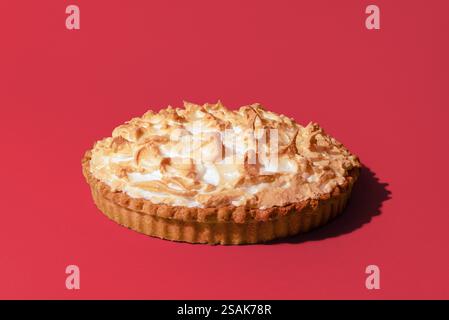 Delicious lemon meringue pie isolated on a pink background Stock Photo