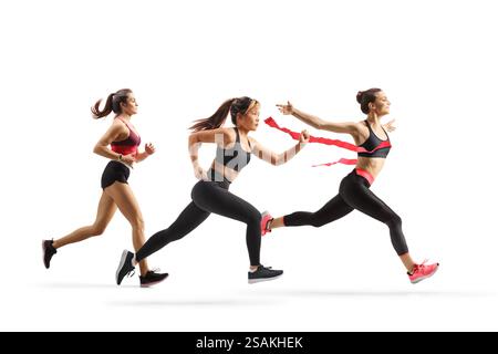 Full length profile shot of a group of women running a race  isolated on white background Stock Photo