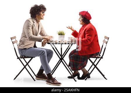 Young man and elderly woman having a coffee at a cafe isolated on white background Stock Photo