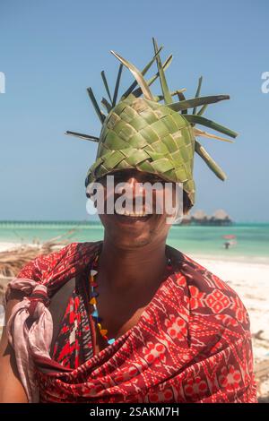 Africa Tanzania, Zanzibar, East Coast, Dongwe,  Maasai man wearing home made hat made from coconut palm fronds Stock Photo
