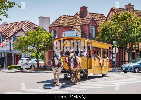 Solvang, CA USA - July 11, 2018: Ride in a horse-drawn streetcar in a California city that evokes old-world European charm. Stock Photo