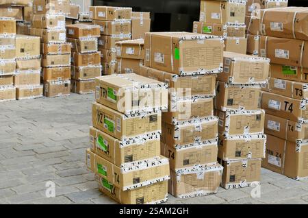 cardboard boxes on the street outside a warehouse Stock Photo