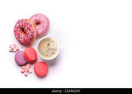 A simple and elegant arrangement of a coffee cup, colorful macarons, and donuts isolated on a clean white background. Ideal for presenting breakfast, Stock Photo
