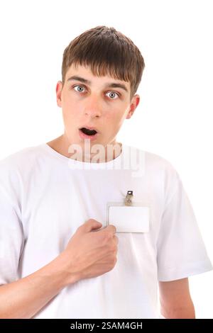Shocked Teenager pointing on his Badge on t-shirt Isolated on the White Background Stock Photo