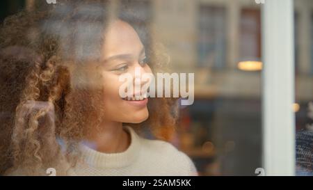 View Through Window Of Woman Meeting Man Sitting In Cafe Or Restaurant Stock Photo
