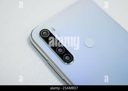 Close-up of smartphone with quad camera in silver tone Stock Photo
