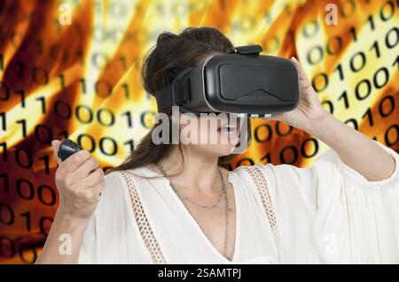 Young woman wearing a set of virtual reality goggles Stock Photo