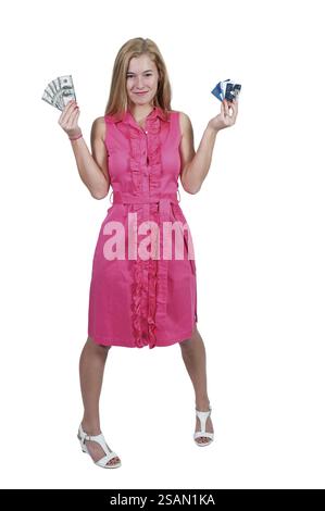Beautiful woman holding a hand full of 100 dollar bills and credit cards Stock Photo