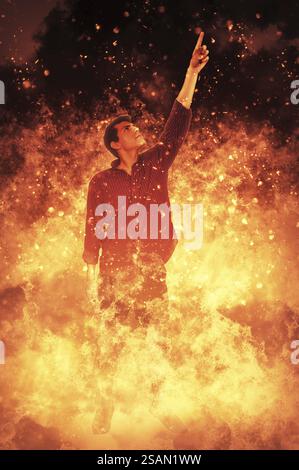 Midst Image Man standing in the midst of a fire Stock Photo - Alamy
