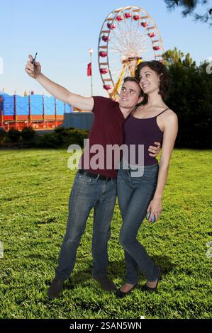 Couple taking a selfie with a cell phone Stock Photo