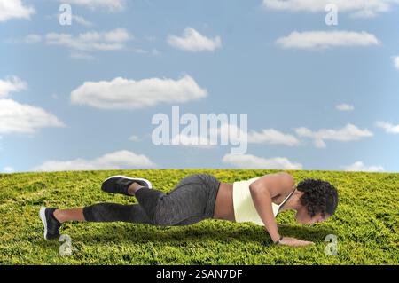 Beautiful woman exercising doing a set of pushups Stock Photo