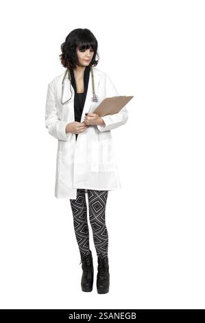 Beautiful young woman doctor in a lab coat holding a patient record Stock Photo
