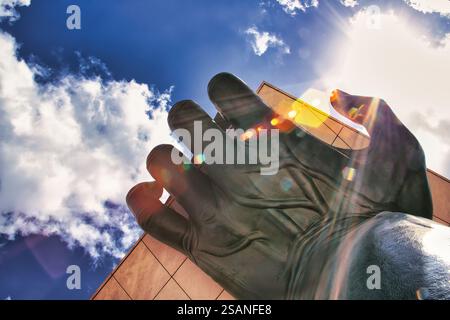 Hand holding building sculpture in Saldanha neighbourhood of Lisbon, Portugal Stock Photo