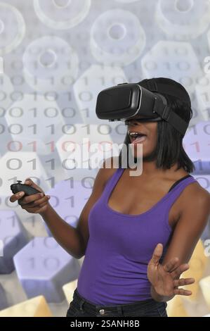 Young woman wearing a set of virtual reality goggles Stock Photo