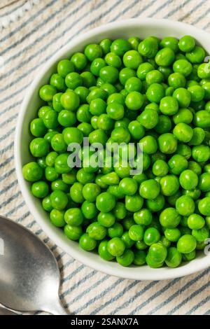 Organic Steamed Frozen Green Peas in a Bowl Stock Photo