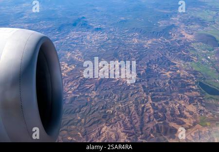 Engine viewed from airplane window over Sierra Madre mountains Mexico Stock Photo