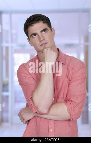 Handsome man thinking thoughts with his brain Stock Photo