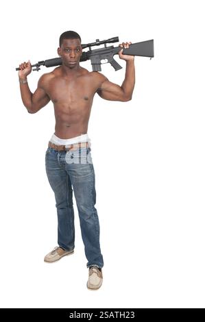 Handsome man holding an automatic assault rifle Stock Photo - Alamy