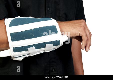 An African American man with a broken arm Stock Photo