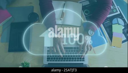 Image of cloud with percent growing over african american businessman using laptop Stock Photo