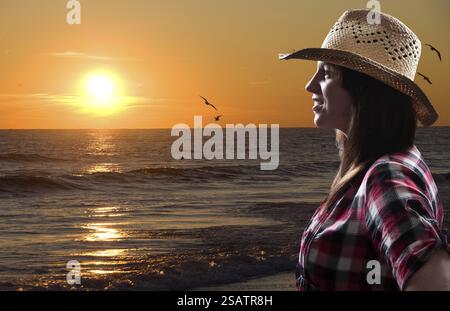 Beautiful young woman in front of a sunset Stock Photo