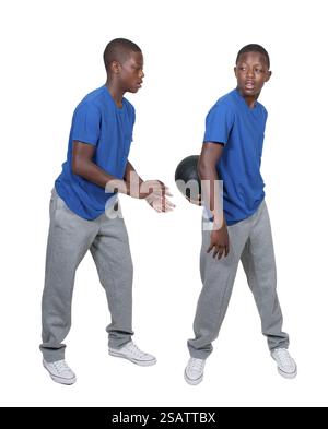 Handsome young black African American teenage man playing basketball Stock Photo