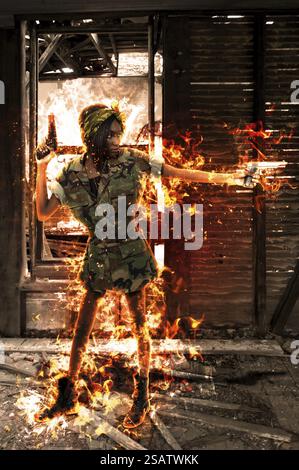 Gun toting beautiful young woman soldier with pistols Stock Photo