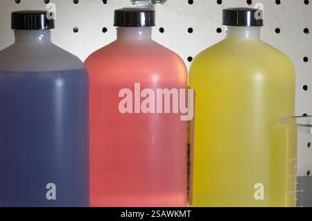 Three bottles of solution in a testing lab Stock Photo