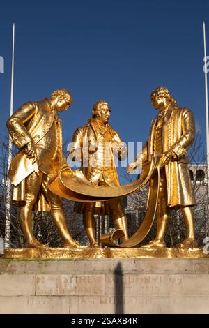 The Golden Boys of Birmingham statue at Centenary Square in Birmingham, England. It depicts Matthew Boulton, James Watt and William Murdoch. Stock Photo