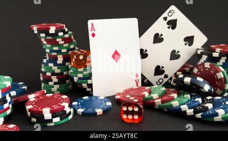 Poker cards and gambling chips on dark background Stock Photo