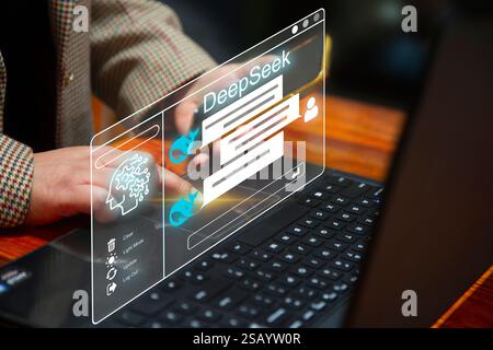 Chat bot concept. Business person chatting with a smart AI using an artificial intelligence chatbot developed by Deepseek. Artificial intelligence sys Stock Photo