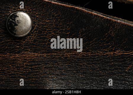 Closeup detail of leather texture background. Black and orange tone Stock Photo