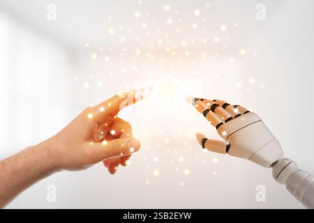 Man and robot touching data network in white room, closeup of hands. Concept of collaboration between AI and human. Modern technology Stock Photo