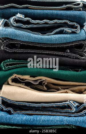 Blue and color jeans isolated on white background, jeans stacked, recycle Stock Photo