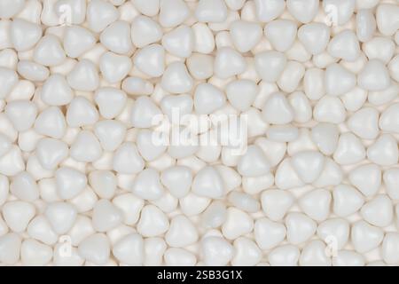 White Heart-Shaped Polystyrene Foam Packing Material Background: Close-up View of Protective Packaging Material Pattern for Shipping and Storage Stock Photo