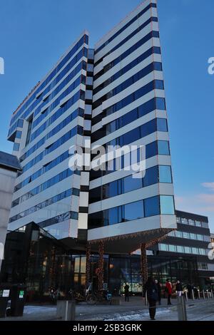 An Anthony Gormley statue at the Clarion Hotel in Tromso, Norway, depicting a lifelike standing figure in bronze, in the artist's signature style Stock Photo