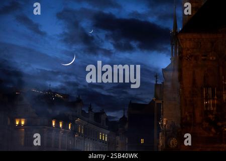 Double exposure of a crescent moon on the streets of Old Town Prague Stock Photo