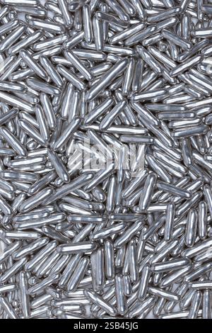 Shiny Silver Sugar Sprinkles Close-Up – Metallic Edible Candy Decorations for Baking, Cake Topping, Desserts, and Festive Pastries Stock Photo