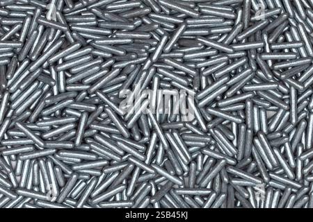 Shiny Silver Sugar Sprinkles Close-Up – Metallic Edible Candy Decorations for Baking, Cake Topping, Desserts, and Festive Pastries Stock Photo