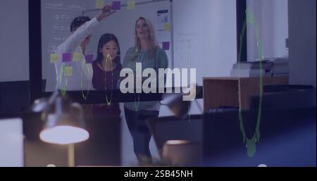 Team collaborating on project with data visualization image over office environment Stock Photo